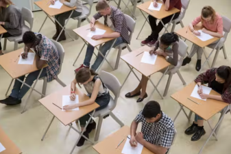 An image of students taking a test in a classroom.